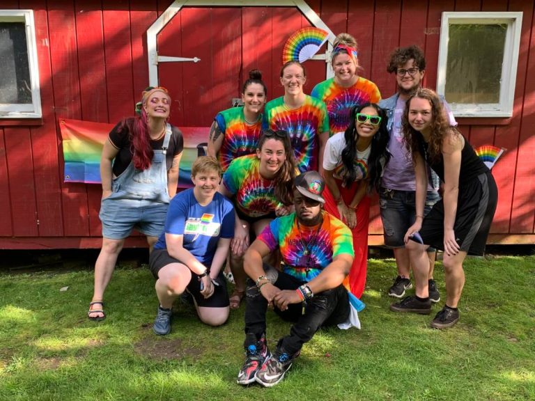 Waltham House staff gather in the backyard, behind the residence, to celebrate Pride Month