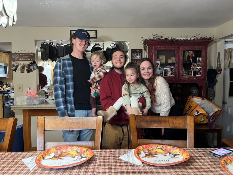 Logan and family gathered in the dining room on Thanksgiving