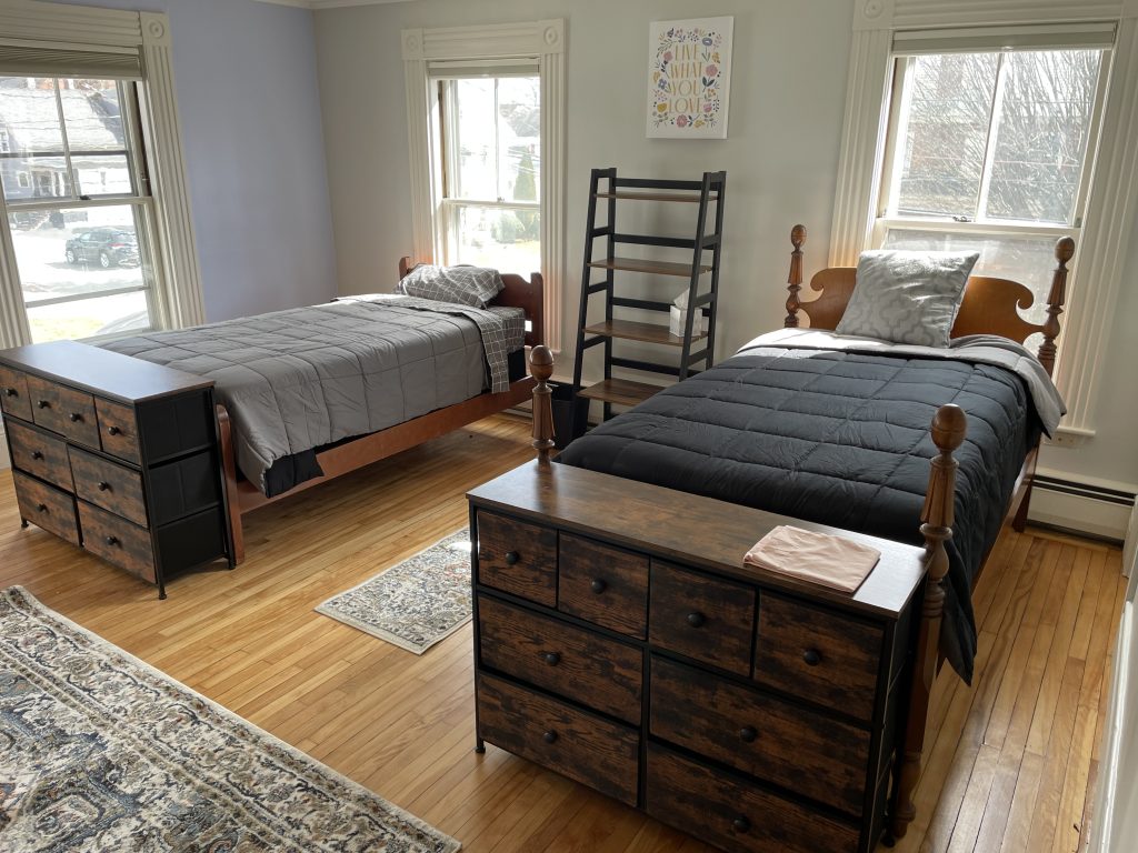two beds inside one of the bedrooms at Unity House